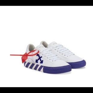 Off-White's signature Low Vulcanized sneakers are reimagined in white .
